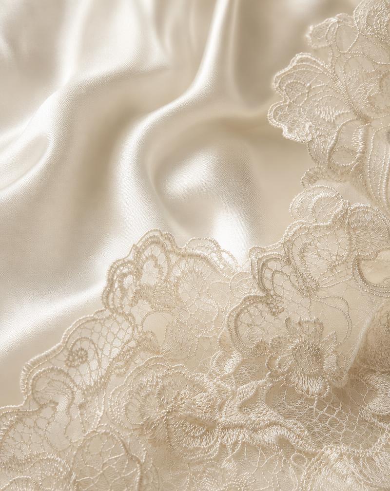 Ivory silk and lace fabric detail